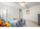 Comfortable bedroom with a twin-size bed and double closets at 20783 E 50Th Pl, Denver, CO 80249