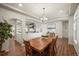 Elegant dining room with wood floors and large archway at 20783 E 50Th Pl, Denver, CO 80249