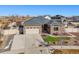 House exterior with three car garage and landscaping at 20783 E 50Th Pl, Denver, CO 80249