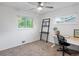 Spare bedroom setup as a home office with carpet and two windows at 10109 W 68Th Ave, Arvada, CO 80004