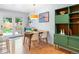 Charming dining area with modern table and chairs, stylish pendant lighting, and access to the outdoor space at 10109 W 68Th Ave, Arvada, CO 80004