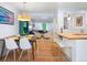 Open-concept dining area with stylish furnishings, seamlessly connecting to the living room and kitchen at 10109 W 68Th Ave, Arvada, CO 80004