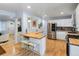 Bright, updated kitchen with stainless steel appliances, butcher block counters, and a cozy breakfast bar at 10109 W 68Th Ave, Arvada, CO 80004