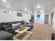 Cozy living room features plush seating, neutral walls, and a pinball machine at 10109 W 68Th Ave, Arvada, CO 80004