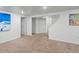 Spacious living room with carpet and access to the staircase and additional rooms at 10109 W 68Th Ave, Arvada, CO 80004