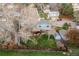 Residential area featuring houses with green lawns and mature trees, aerial view at 9340 W Burgundy Ave, Littleton, CO 80123