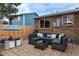 Paver patio with comfortable seating and backyard play area at 9340 W Burgundy Ave, Littleton, CO 80123
