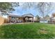 Large grass backyard featuring a patio, pergola, and shed at 9340 W Burgundy Ave, Littleton, CO 80123