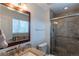 Updated bathroom with a tiled shower, granite countertop, and modern fixtures at 9340 W Burgundy Ave, Littleton, CO 80123