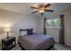 Relaxing bedroom with a comfortable bed, a bedside lamp, and a window with natural light at 9340 W Burgundy Ave, Littleton, CO 80123