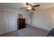 Comfortable bedroom featuring a ceiling fan, closet, and neutral decor at 9340 W Burgundy Ave, Littleton, CO 80123