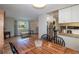 Cozy dining area adjacent to the kitchen, with hardwood floors and ample natural light at 9340 W Burgundy Ave, Littleton, CO 80123