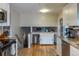Bright kitchen with hardwood floors, granite countertops, white cabinets, and stainless steel appliances at 9340 W Burgundy Ave, Littleton, CO 80123