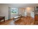 Comfortable living area with hardwood flooring and large window views of the outdoors at 9340 W Burgundy Ave, Littleton, CO 80123