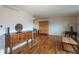 Spacious living room with hardwood floors and tasteful wooden furniture at 9340 W Burgundy Ave, Littleton, CO 80123