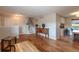Inviting living space featuring hardwood floors, natural light, and an open staircase at 9340 W Burgundy Ave, Littleton, CO 80123