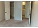 Bedroom with closet, access to ensuite bath and carpeted floor at 8828 E Florida Ave # 103, Denver, CO 80247