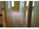 Hallway with tan carpet leading to different rooms at 8828 E Florida Ave # 103, Denver, CO 80247