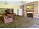 Inviting community lounge with a cozy fireplace, plush seating, and ample natural light at 8828 E Florida Ave # 103, Denver, CO 80247