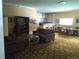 Inviting lounge area with plush seating, a kitchenette, and ample space for gatherings at 8828 E Florida Ave # 103, Denver, CO 80247