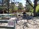 Outdoor grilling area featuring multiple grills, picnic tables, and a spacious gathering spot at 8828 E Florida Ave # 103, Denver, CO 80247