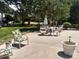 Outdoor patio featuring comfortable seating, lush greenery, and a peaceful environment at 8828 E Florida Ave # 103, Denver, CO 80247