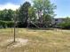 Community playground with swings, a slide, and climbing equipment for enjoyment at 8828 E Florida Ave # 103, Denver, CO 80247