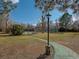 Well-maintained tennis courts surrounded by mature trees, offering a scenic setting for recreation at 8828 E Florida Ave # 103, Denver, CO 80247