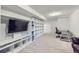 Finished basement with a media center, work space and neutral carpet at 10890 Stuart Ct, Westminster, CO 80031