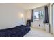 Bedroom with neutral walls, and a large window for lots of natural light at 10890 Stuart Ct, Westminster, CO 80031