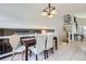 Elegant dining area with tiled flooring, chandelier, and staircase access at 10890 Stuart Ct, Westminster, CO 80031