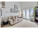 Bright living room featuring a vaulted ceiling, large windows, and comfortable seating at 10890 Stuart Ct, Westminster, CO 80031
