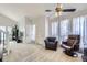 Cozy living area with plush carpeting, neutral tones, and large windows for ample natural light at 10890 Stuart Ct, Westminster, CO 80031