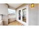 Balcony with wood floor and doors leading to office space with outside view at 5640 S Marshall St, Denver, CO 80123