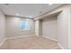 Finished basement bedroom with a large window at 5640 S Marshall St, Denver, CO 80123