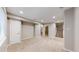 Open basement area with access to bathroom and stairs at 5640 S Marshall St, Denver, CO 80123