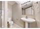 Finished basement bathroom includes a pedestal sink and shower at 5640 S Marshall St, Denver, CO 80123