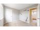 Neutral bedroom featuring carpeting and door to attached bathroom at 5640 S Marshall St, Denver, CO 80123
