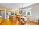 Bright kitchen with hardwood floors, stainless steel appliances, and a cozy breakfast nook for casual dining at 5640 S Marshall St, Denver, CO 80123