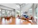 Sun-drenched living room with soaring ceilings, hardwood floors, and stylish modern furnishings for comfortable living at 5640 S Marshall St, Denver, CO 80123