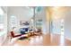 Bright living room with soaring ceilings, hardwood floors, and ample natural light for a welcoming atmosphere at 5640 S Marshall St, Denver, CO 80123