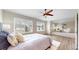 Large Primary bedroom with sitting area, a ceiling fan and large windows at 5640 S Marshall St, Denver, CO 80123