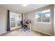 Home office with an ergonomic chair, modern desk setup, and a sunny window view at 5640 S Marshall St, Denver, CO 80123