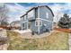 Back exterior view of a home with a patio and landscaped backyard at 14669 Eagle River Run, Broomfield, CO 80023
