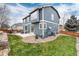 Spacious backyard with a patio area perfect for outdoor entertaining and relaxing at 14669 Eagle River Run, Broomfield, CO 80023