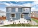 Large backyard with a patio, lush lawn, and ample space for outdoor activities at 14669 Eagle River Run, Broomfield, CO 80023