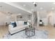 Bright living room with modern furnishings, staircase, and neutral decor at 14669 Eagle River Run, Broomfield, CO 80023