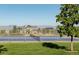 Well-maintained tennis court with a view of the mountains and neighborhood homes in the background at 14669 Eagle River Run, Broomfield, CO 80023