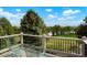 Relaxing backyard view from the deck, featuring serene greenery and distant water views at 7955 S Bemis St, Littleton, CO 80120