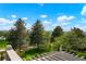 Scenic view from the back of the house, showcasing mature trees and lush landscaping at 7955 S Bemis St, Littleton, CO 80120